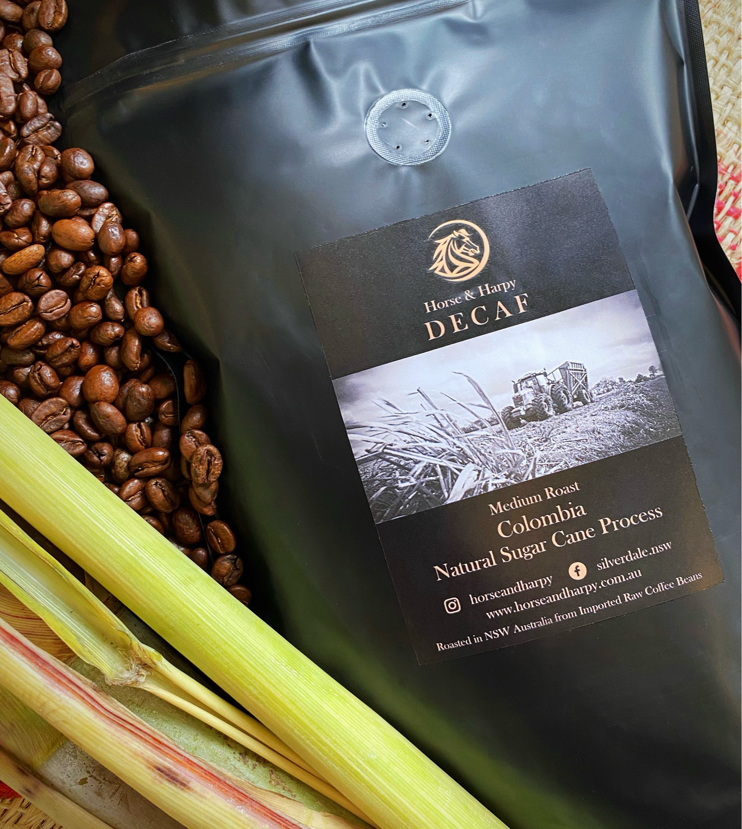 Decaf natural sugar cane by Horse and Harpy, fresh whole sugar cane stalks with leafy tops, ideal for juicing or cooking.